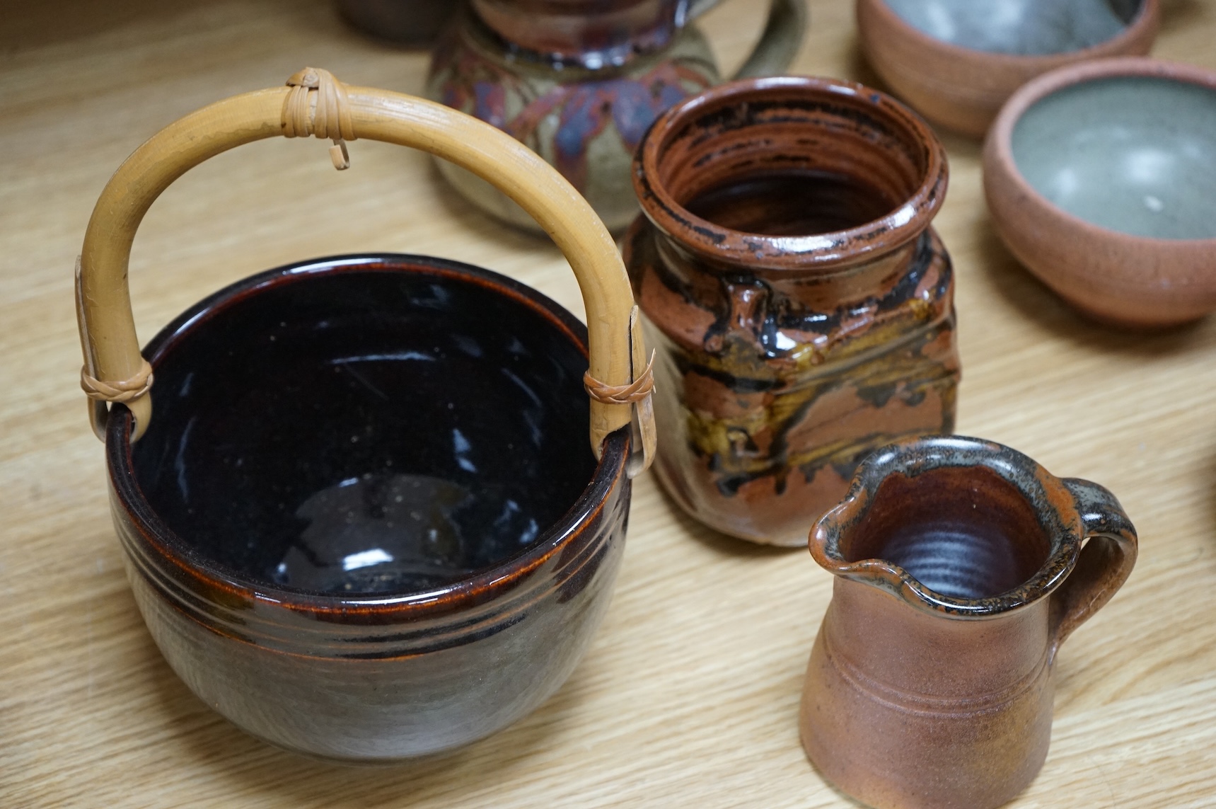 A large group of 20th century signed and unsigned Studio pottery, tallest 23cm high